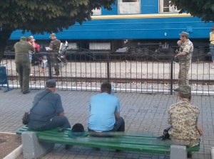 Russian miltary harassing a mother at the train checkpoint